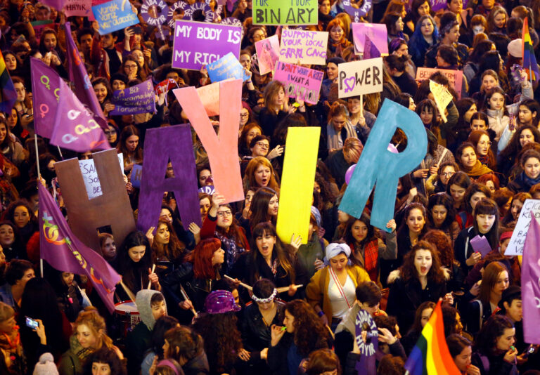 Activists shout slogans at the main shopping and pedestrian street of Istiklal during an International Women's Day rally in central Istanbul